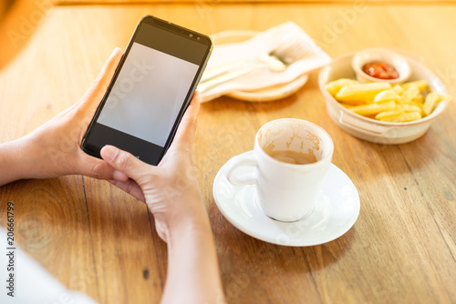 Play the mobile phone and drinking coffee in the morning.