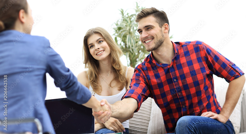 woman psychologist greets the customer before the beginning of the family session. woman psychologist greets the customer before the beginning of the family session.