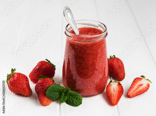 Jar with strawberry smoothie