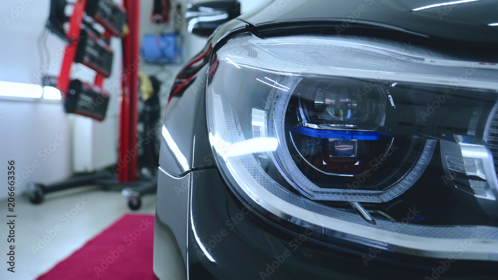 Car on a car wash, close-up headlight Car on a car wash, close-up headlight