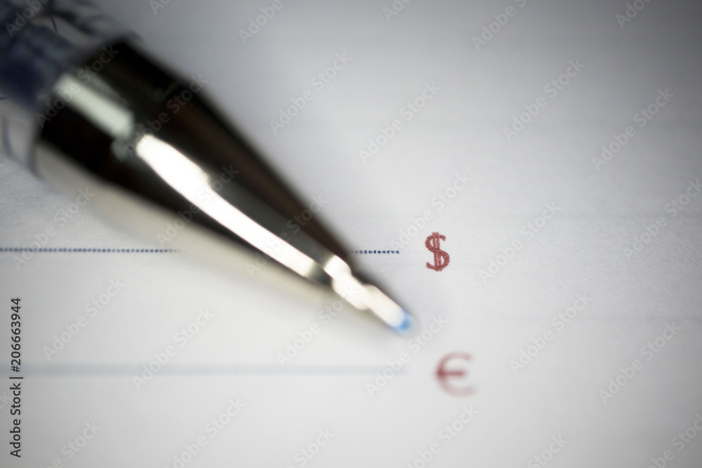pen lies on a document or notebook, two blank graphs and dollar and Euro signs pen lies on a document or notebook, two blank graphs and dollar and Euro signs
