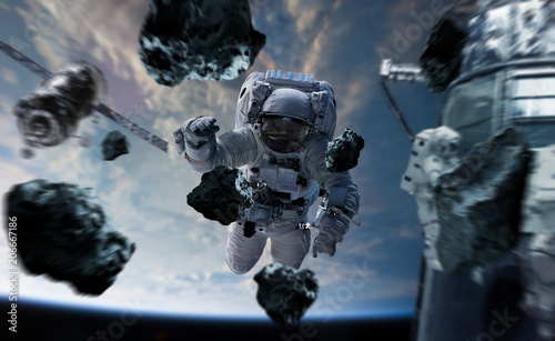 Fototapeta Naklejka Na Ścianę i Meble -  Astronaut working on a space station 3D rendering elements of this image furnished by NASA