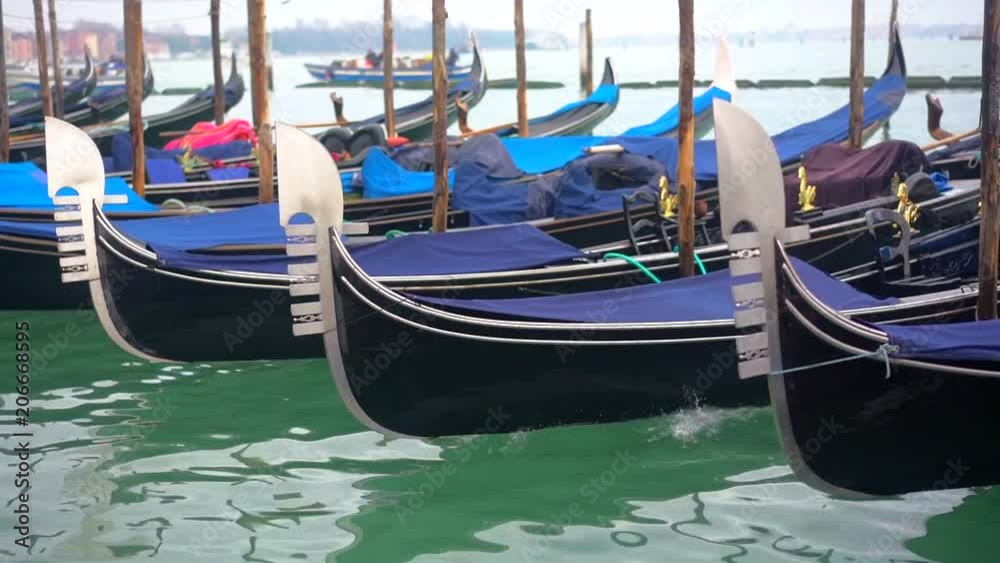 Rows of traditional wooden gondolas Rows of traditional wooden gondolas