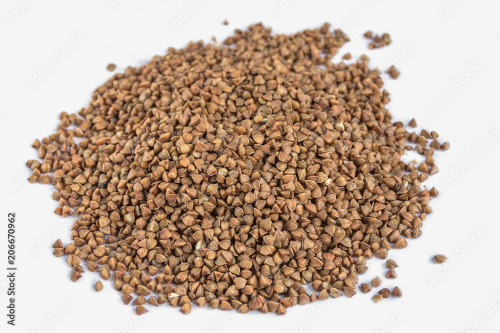 Pile of buckwheat isolated on white background. Pile of buckwheat isolated on white background.