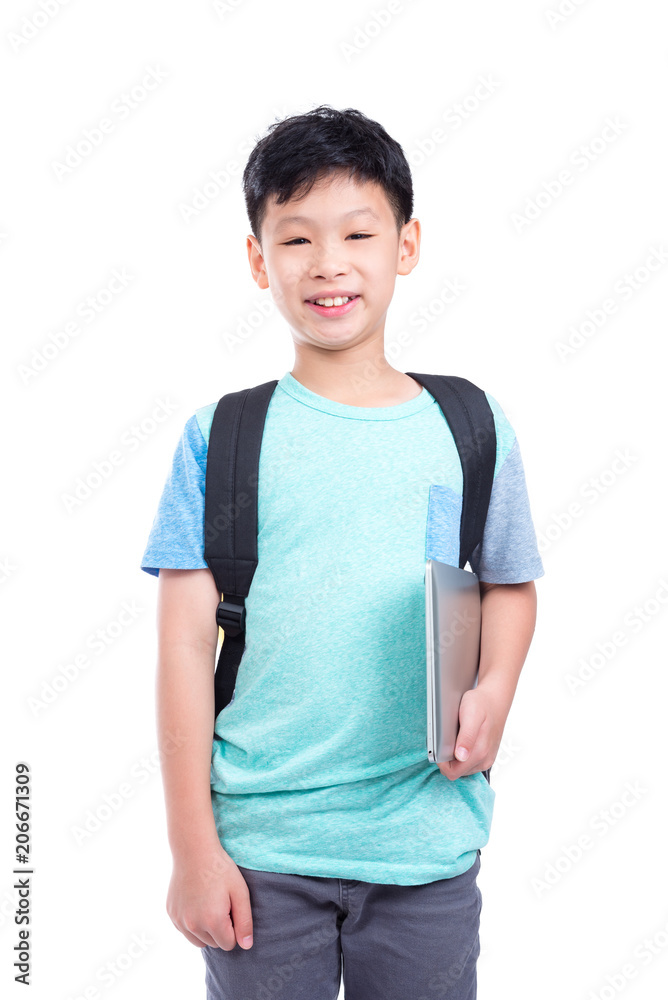 Young asian boy holding notebook computer and smiles over white background