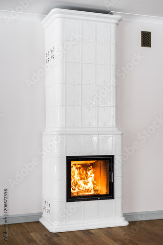 Bright tiled stove with fire