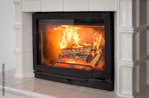 Tiled stove  fireplace. White tiles closeup