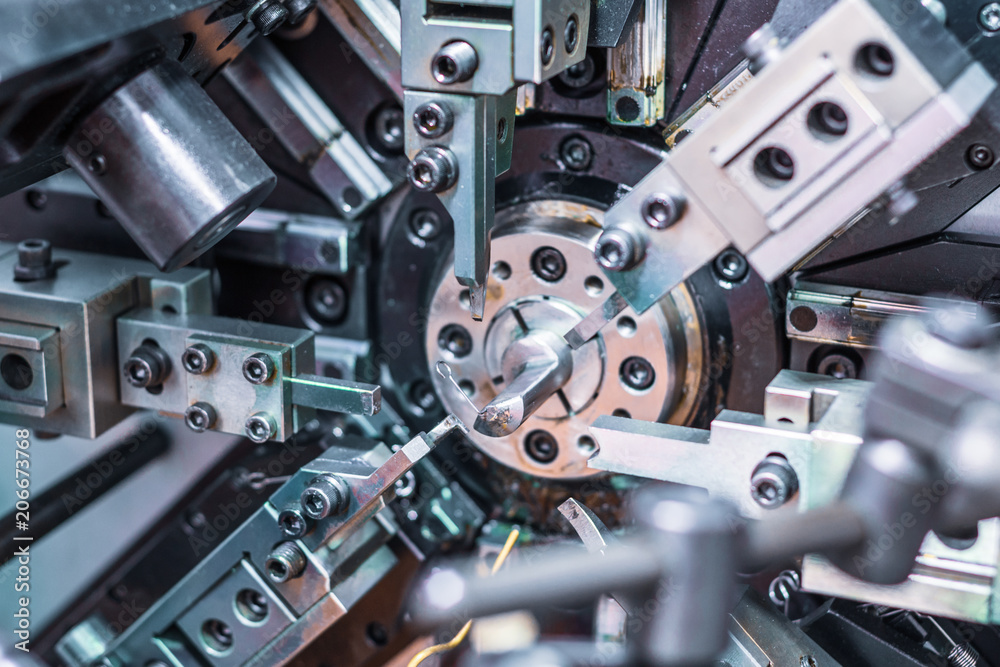 Naklejka premium Automatic CNC bending machine. Manufacture of a spring of fine wire