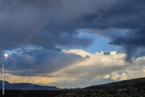 Threatening storm clouds are hanging low over mono lake, near the town of Lee Vining, in the Sierra Nevada mountain range. Sierra Nevadas, Eastern California, USA.