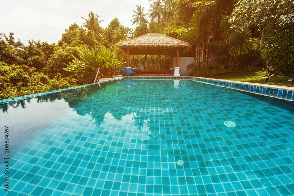 Veranda private swimming pool near luxury villa. Sunny summer vacation