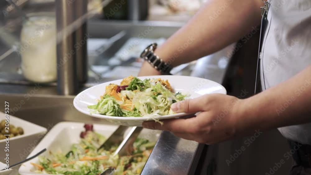 People takes food at buffet closeup People takes food at buffet closeup