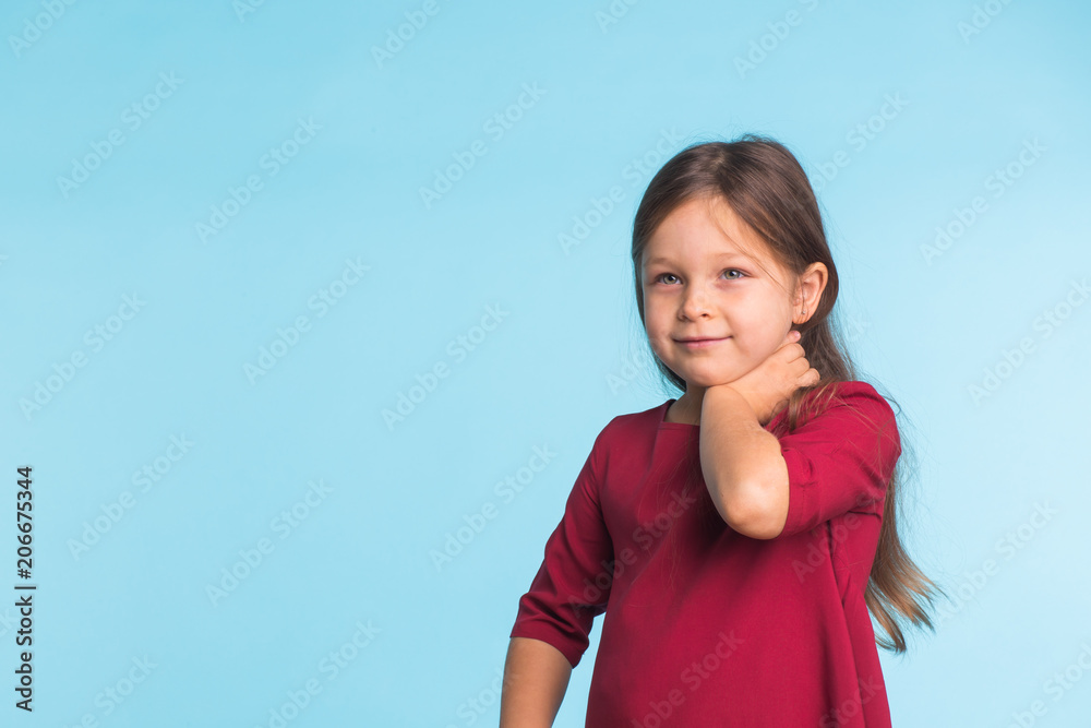 cute cheerful little girl portrait, isolated on blue background with copy space cute cheerful little girl portrait, isolated on blue background with copy space