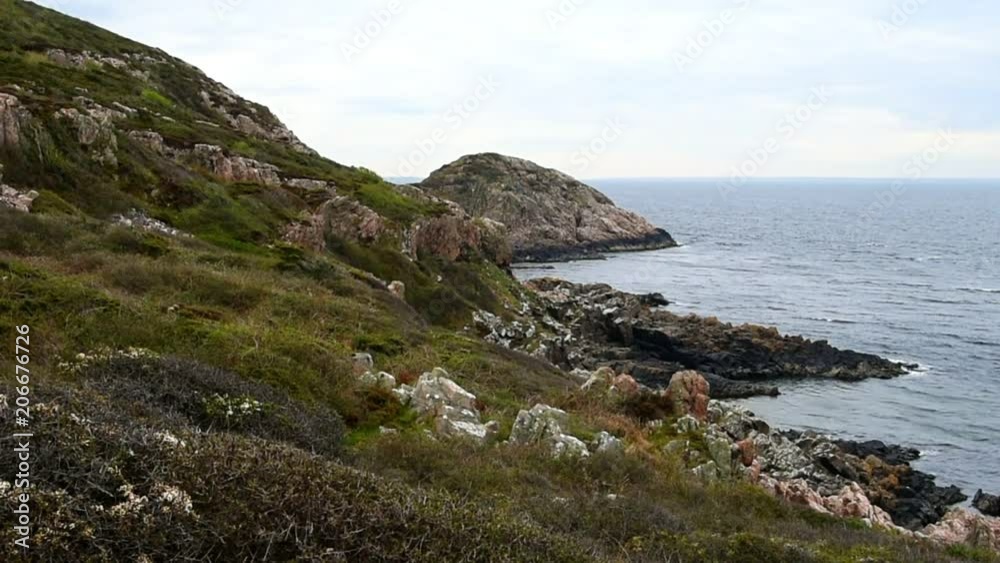 The rocky shores of Kullaberg nature reserve in Sweden on an overcast and windy day. The rocky shores of Kullaberg nature reserve in Sweden on an overcast and windy day.