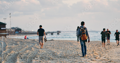 Photos People on the beach in Tel Aviv.