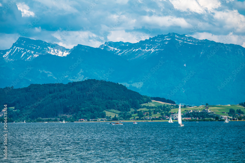 Springtime sailing and kayaking along the shores of the Upper Zurich Lake (Obersee), Switzerland