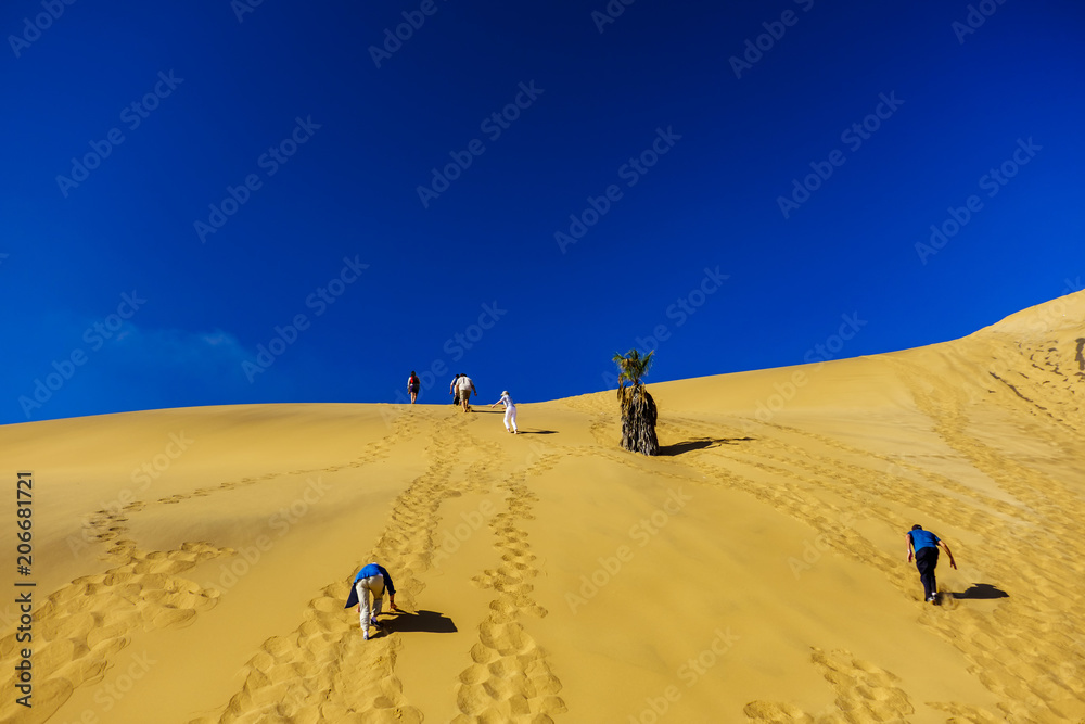 Tourist climb Dune 7 Namibia