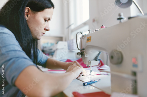 Female Working On Sewing Machine