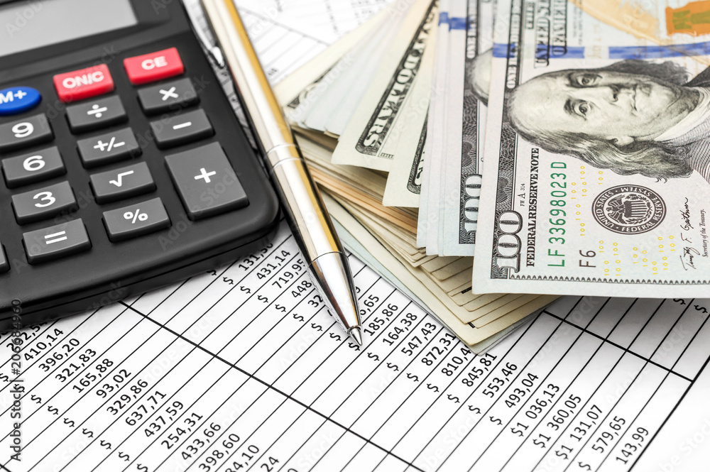 Pen, calculator and money on document with financial data. Pen, calculator and money on document with financial data.