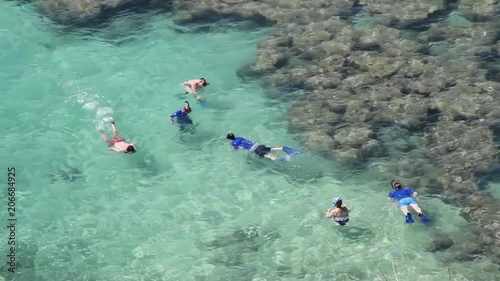 Snorkellers in the coral reefs of Hanauma Bay, Oahu, Hawaii