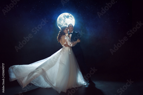Wallpaper Mural Mysterious and romantic meeting, the bride and groom under the moon