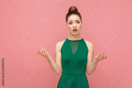 I don't know. Portrait of attractive beautiful puzzled woman photo