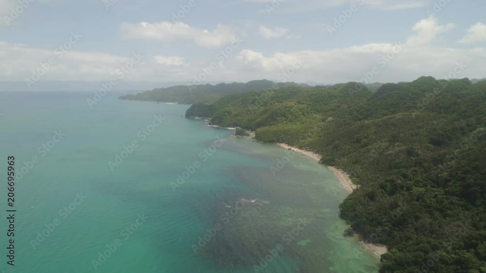 Aerial view coastline with beach and mountains covered with tropical forest in province Caramoan, Philippines. Landscape with sea, mountains and beach. Aerial view coastline with beach and mountains covered with tropical forest in province Caramoan, Philippines. Landscape with sea, mountains and beach.
