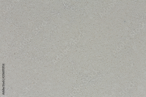 Light grey surface of synthetic rock.