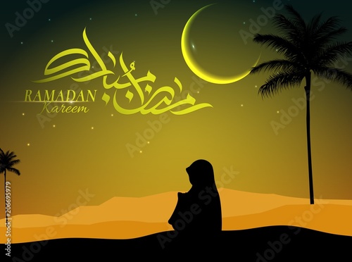 Silhouette of a muslim women praying in the desert