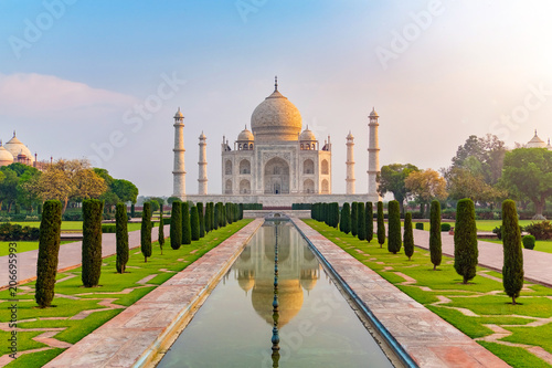 Fototapeta Taj Mahal front view reflected on the reflection pool, an ivory-white marble mausoleum on the south bank of the Yamuna river in Agra, Uttar Pradesh, India