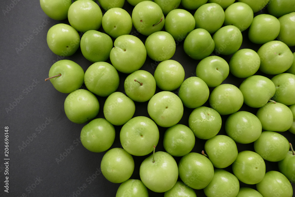 green sour plums,wonderful fresh green plums on black ground
green sour plums,wonderful fresh green plums on black ground