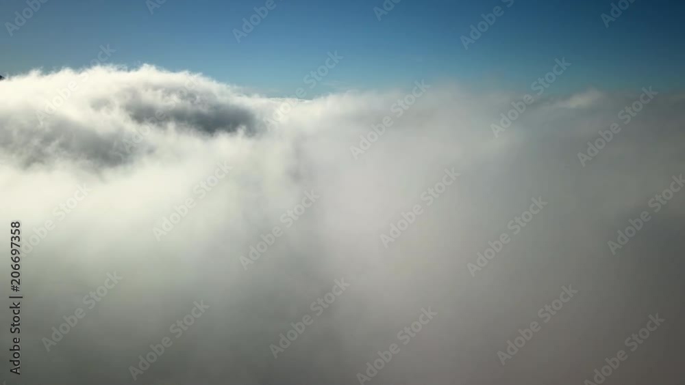 The thick white clouds on the sky on a sunny day The thick white clouds on the sky on a sunny day