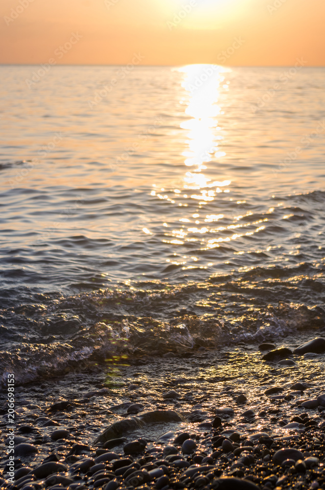 Obraz premium Amazing sea sunset, the sun, waves, clouds