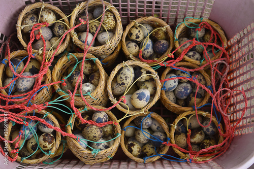 Many eggs in the basket for boil or steamed in hot spring. Quail eggs.