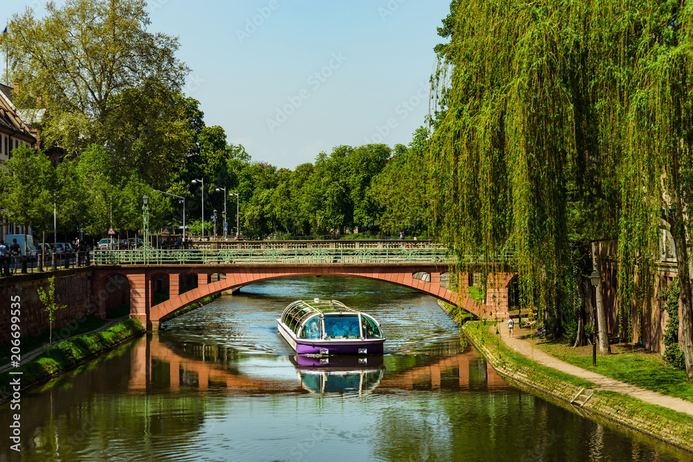Fototapeta premium Travel boat in Strasbourg . Reflections in the river Ill