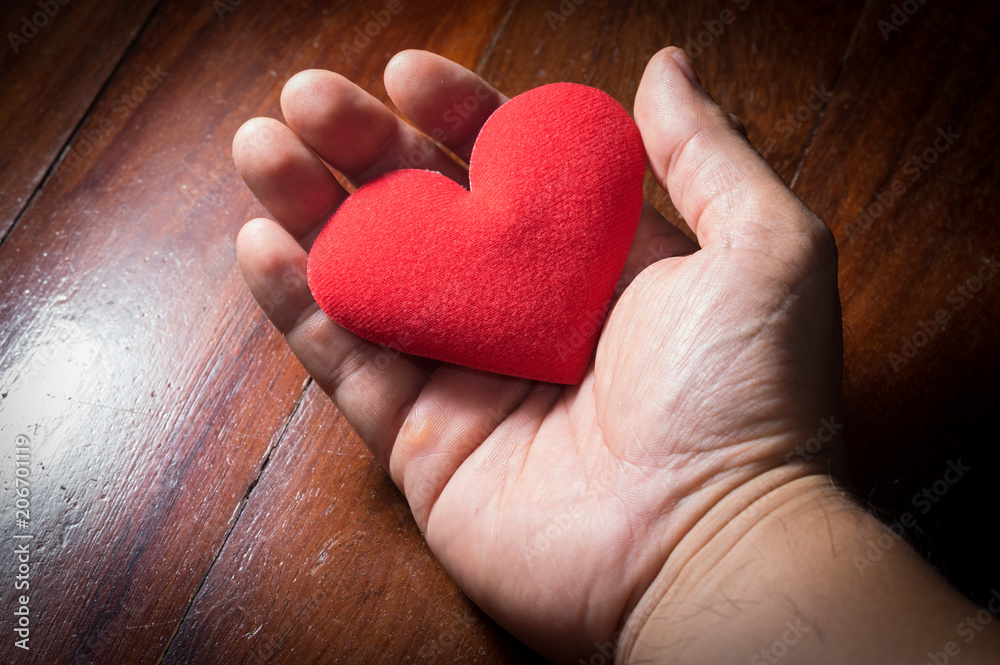 Red heart in human palm. Red heart in human palm.