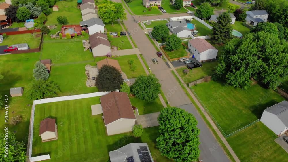 A high angle tilt up forward flyover of a typical Pennsylvanian residential neighborhood. Pittsburgh suburbs. A high angle tilt up forward flyover of a typical Pennsylvanian residential neighborhood. Pittsburgh suburbs.