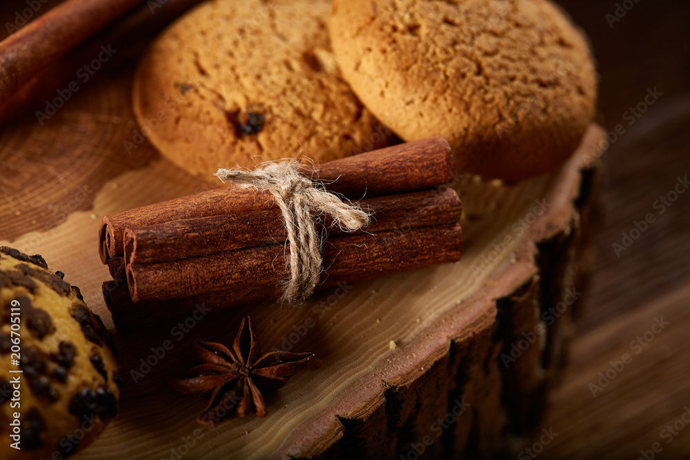 Sweet assortment of biscuits on a round wood log over rustic wooden background, close-up, selective focus. Sweet assortment of biscuits on a round wood log over rustic wooden background, close-up, selective focus.