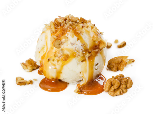 Vanilla ice cream with walnut and caramel isolated on white photo