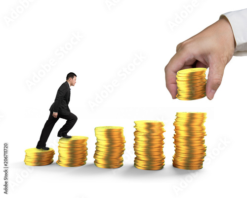 Man climbing step stairs of golden coins stacked by hand