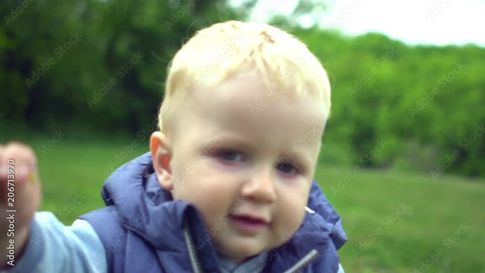 Little boy have a rest with father in park Little boy have a rest with father in park