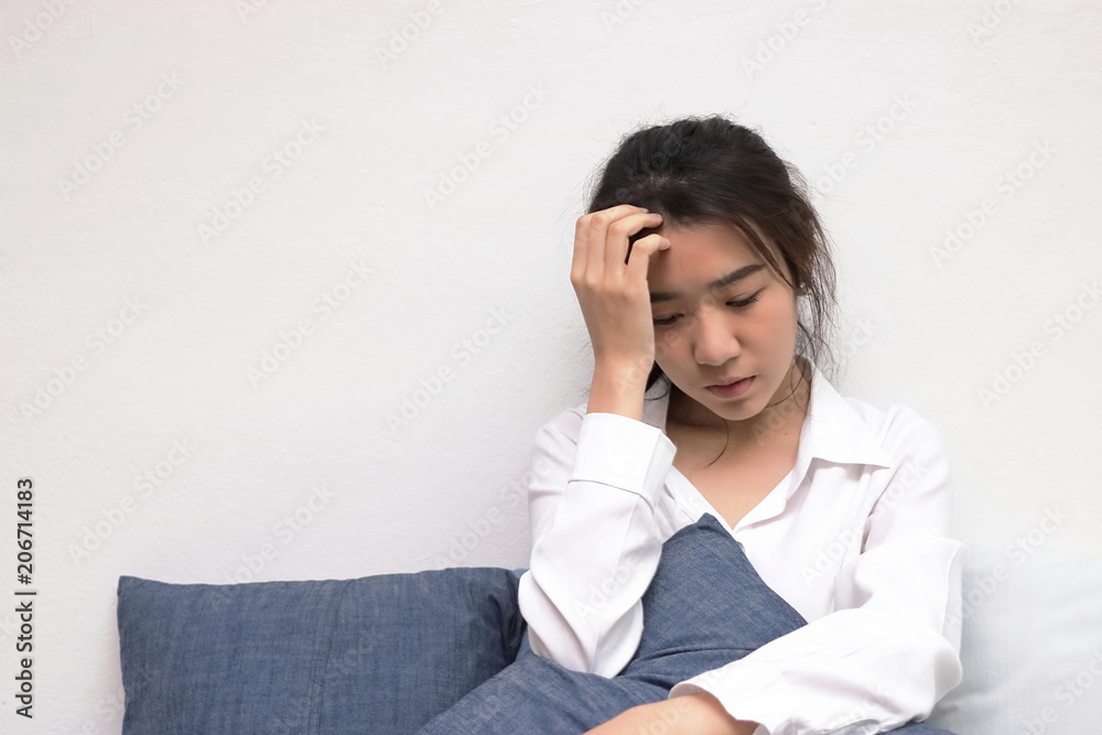 Anxiety depressed young Asian woman with hands on forehead suffering from trouble. Anxiety depressed young Asian woman with hands on forehead suffering from trouble.