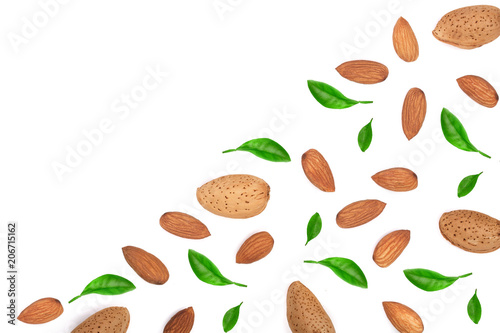 almonds decorated with leaves isolated on white background with copy space for your text. Top view. Flat lay pattern