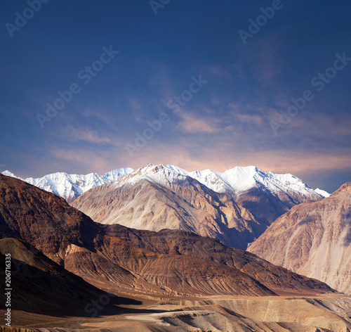 Karakoram mountain range at sunset in Ladakh, Jammu and Kashmir, North India photo