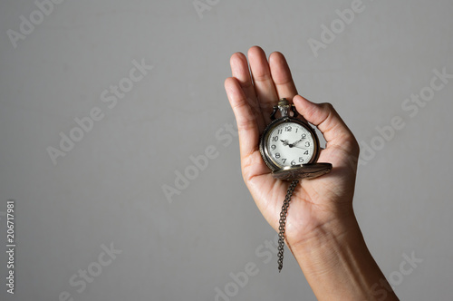 Pocket watch in female hand.