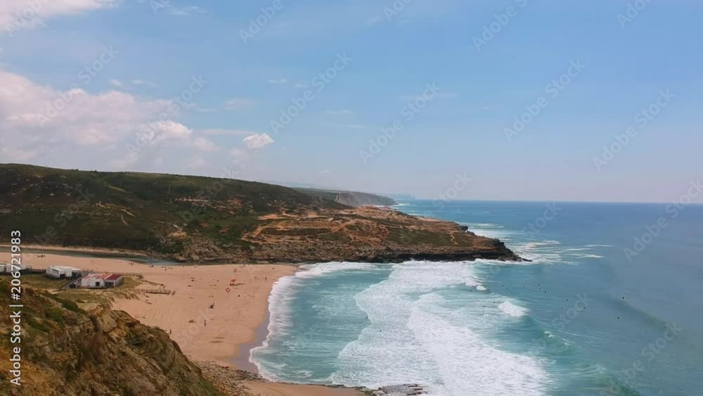 Aerial view from a surf spot with waves and a group of surfers in Ericeira, Portugal Aerial view from a surf spot with waves and a group of surfers in Ericeira, Portugal