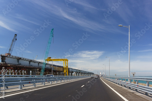 Crimean bridge in may 2018. On the left is the construction of the overpass of the railway bridge