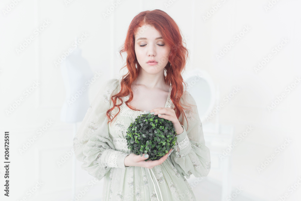 Tender retro portrait of a young beautiful dreamy redhead woman. Tender retro portrait of a young beautiful dreamy redhead woman.