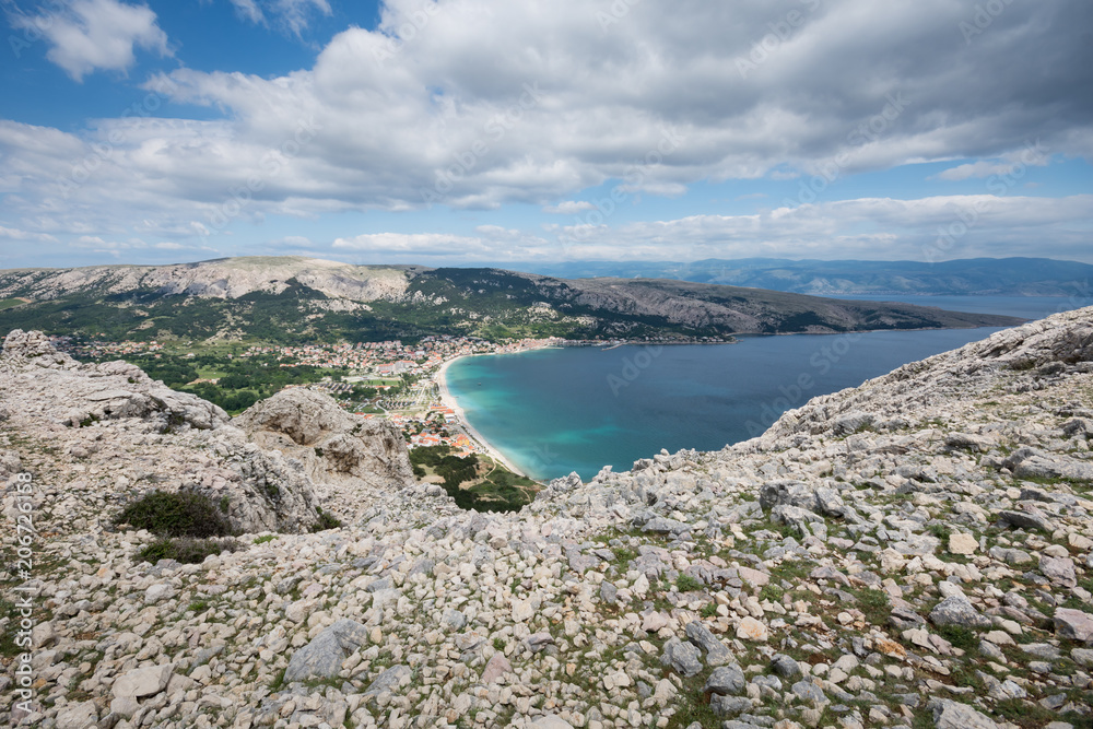 Baska on Island of Krk, Croatia, seen from the top of the karst ridge surrounding it, with the moon-like surface and very little vegetation.