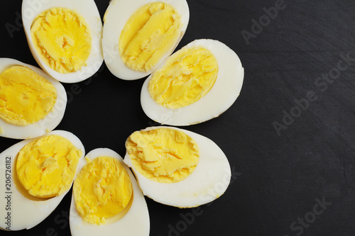 Hard Half Boiled Eggs, Sliced in Halves Food Ingredient Preparation Black Background