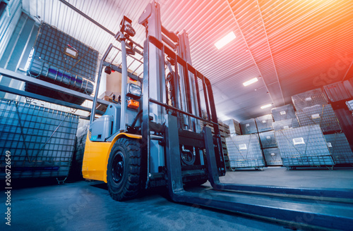 Forklift loader. Pallet stacker truck equipment at warehouse